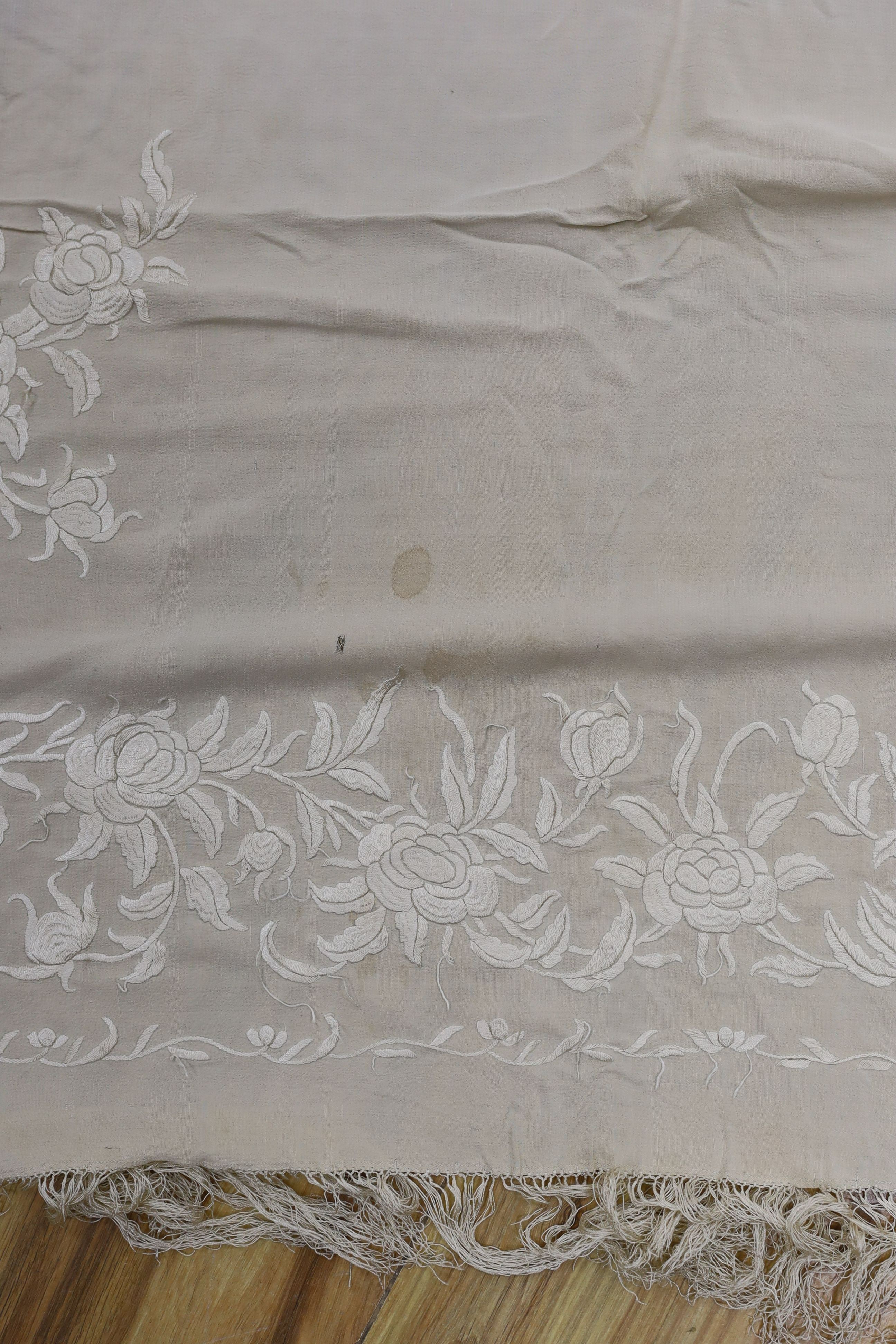 A 19th century cream embroidery on cream silk shawl together with a smaller later shawl